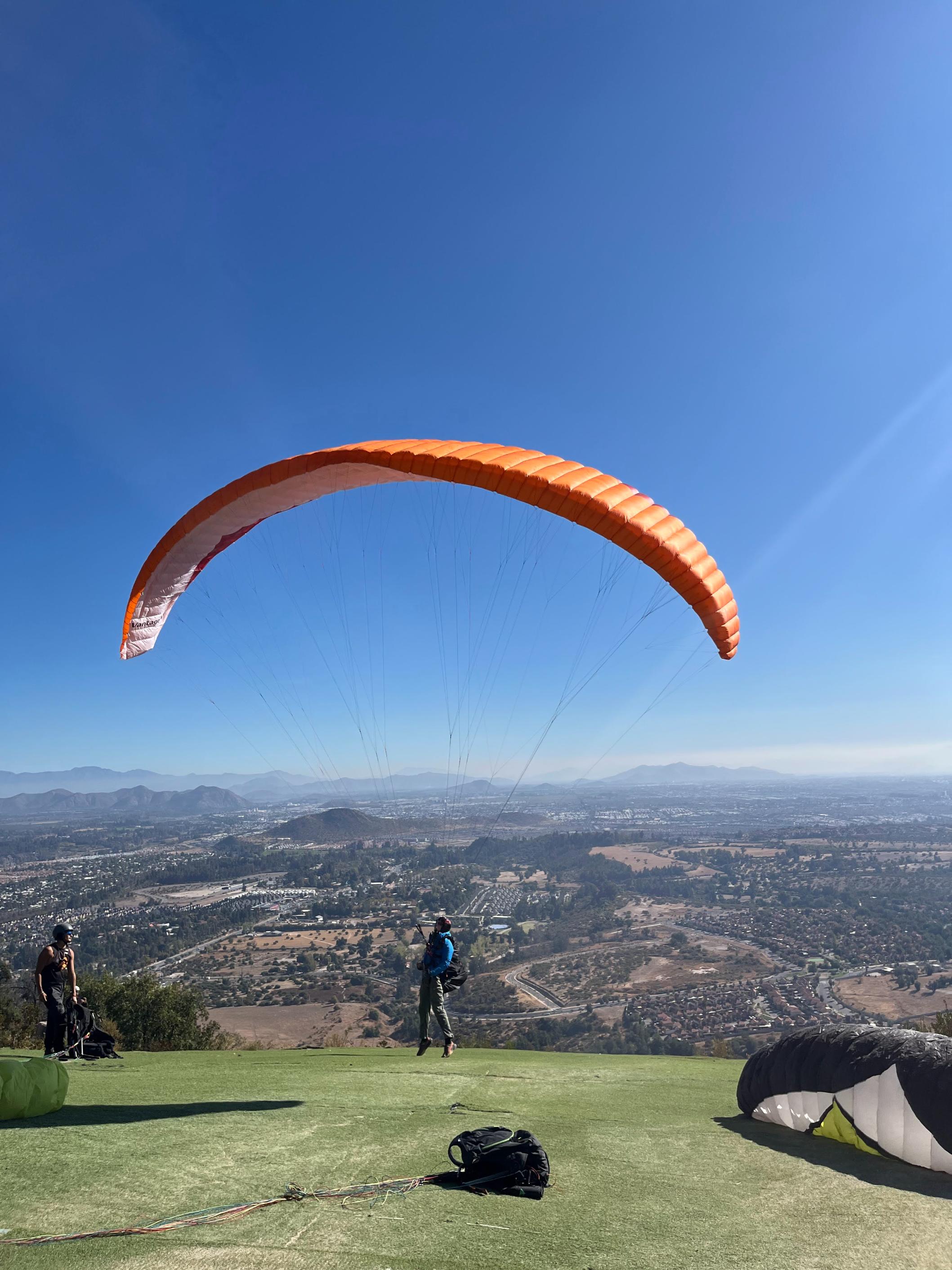 A paraglider with a magnificent view in the background. Photo.