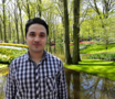 Portrait. Mojtaba Mahdavi in a park.