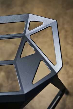 Chair in black plastic. Photo.