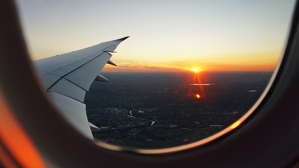 View from an airplane window at dusk. Photo.